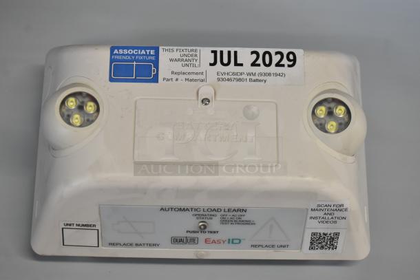 Dual Lite LED emergency light, model EVHC6IDP-WM, features battery compartment, labeled warranty until July 2029.