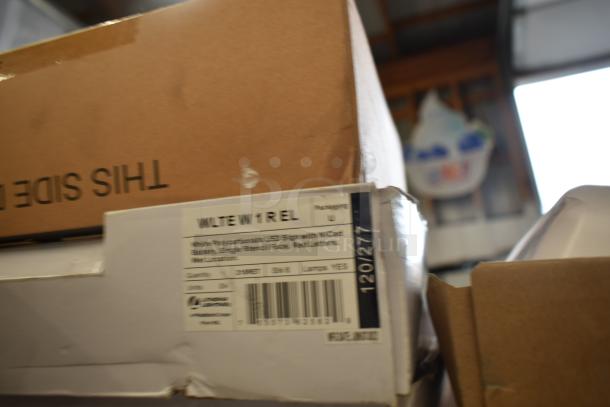 Box of Dual Lite LED emergency lights, model W1REL. Features include NiCad battery, wet location use. Includes 47 items.