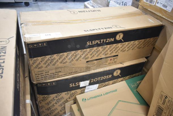 SereneLife SLSPLT12IN portable AC and SLSPLT12OT20SR outdoor unit in original packaging. Boxes show model numbers and weights.