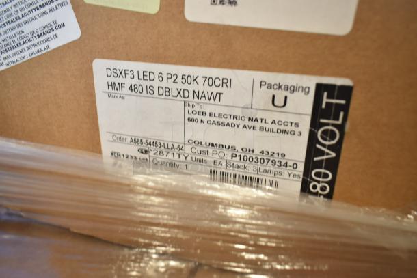 Box with label showing Lithonia Lighting DSXF3 LED 6 P2 50K 70CRI floodlight; scratch and dent items; 32 total units.