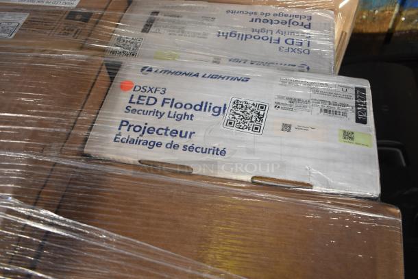 32 brand new Lithonia Lighting DSXF3 LED Floodlights, scratch and dent condition, in sealed packaging with labels.
