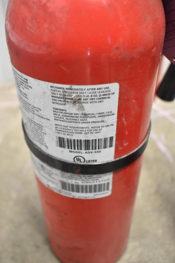 Red fire extinguisher, Model ADV-550, with UL label. Requires recharge after use. Local pickup only, no shipping.