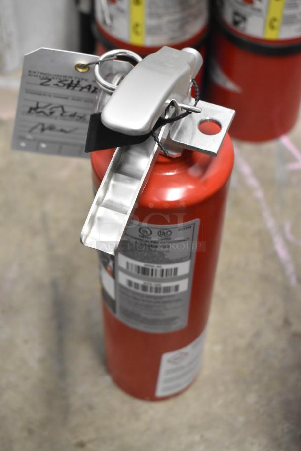 Red fire extinguisher with a safety pin and labels visible. Offers seven units. Pickup required, no shipping available.