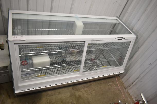 Brand new KoolMore CDC-250-WH countertop display refrigerator. Features glass doors, wire shelves, minor scratches. 115V, 1 Phase.