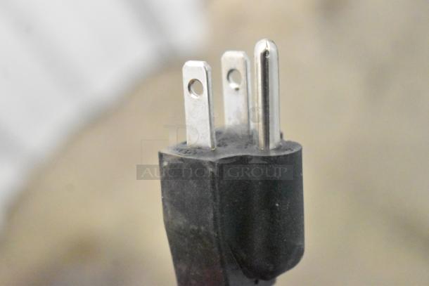 Close-up of the power plug for a KoolMore CDC-250-WH Display Refrigerator, 115 Volts, 1 Phase, black casing.