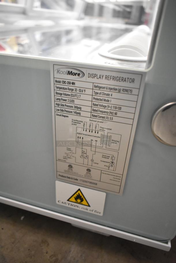 BRAND NEW KoolMore CDC-250-WH display refrigerator, 115V, with temperature range 32-53.6°F. Scratch and dent condition.