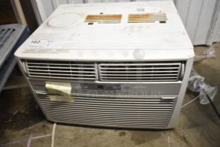 Frigidaire window mount AC unit, 115 volts, 1 phase, used condition with visible rust and wear, control panel intact.