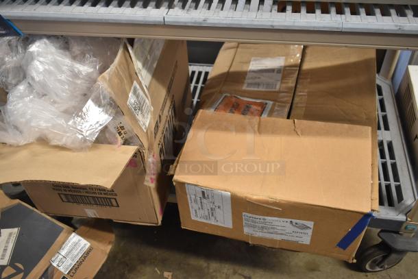 Boxes containing IBM Monitor and Toshiba 4900-745 Computer Tower on a shelf. Some shipping labels visible.