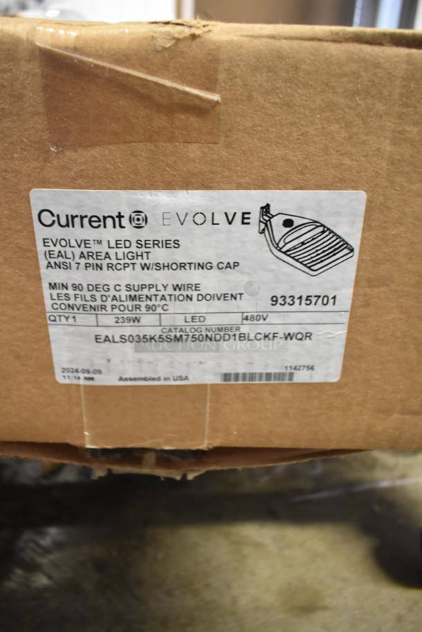 Cardboard box with Current Evolve LED Area Light label, model 93315701, 239W, 480V, assembled in the USA.