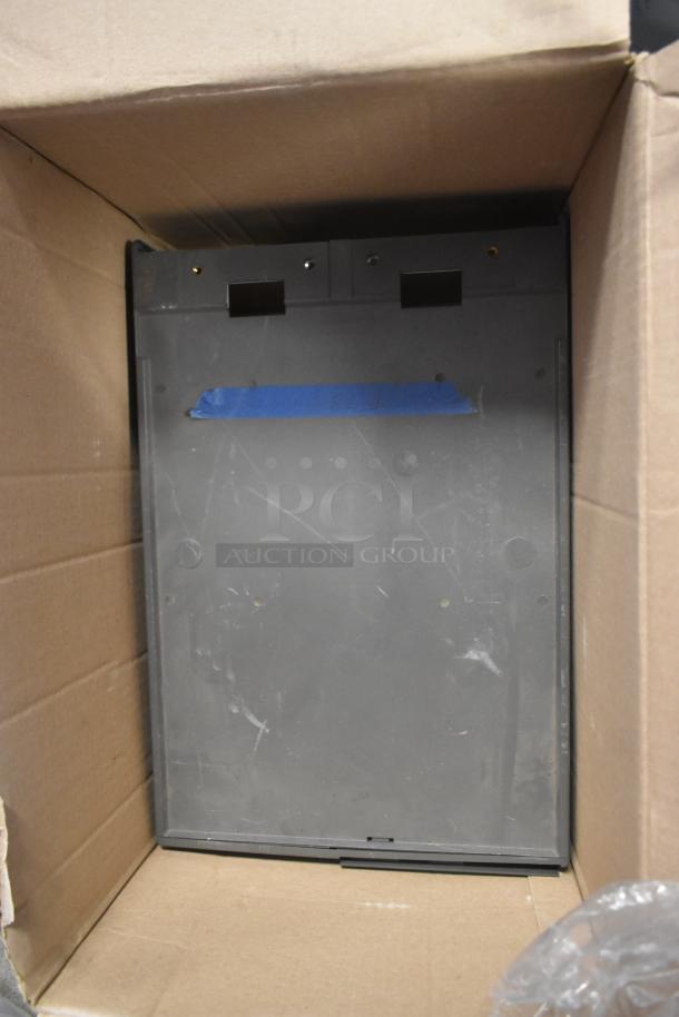 IBM Monitor and Toshiba 4900-745 Computer Tower in cardboard box, moderate wear, blue tape marking visible.