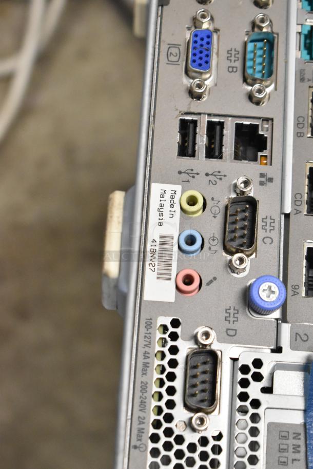 Rear panel of Toshiba 4900-745 computer tower showing various ports, labeled "Made in Malaysia," with condition unknown.