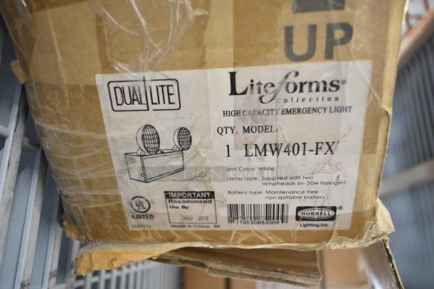 Box with Dual Lite LMW401-FX emergency light. High capacity, white, includes two halogen lamps. Made in 2013.