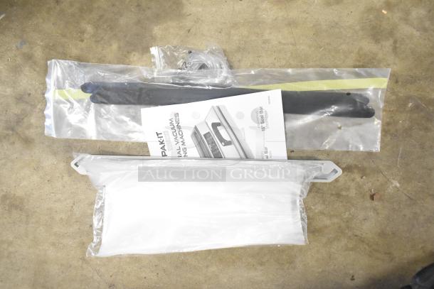 Brand new VacPak-It 186UVME16SS vacuum packing machine parts, 16" seal bar, and manual in packaging.