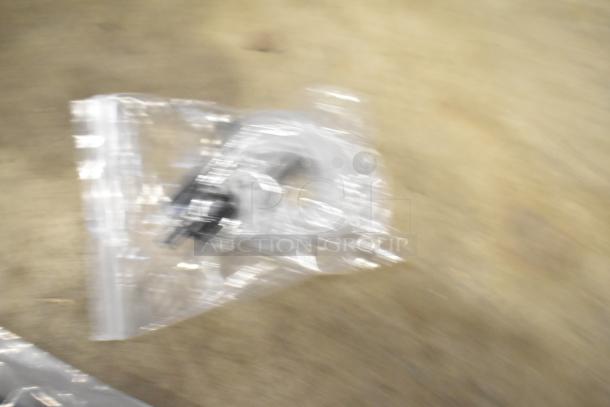 Blurry image of a VacPak-It 186UVME16SS vacuum packing machine. Features a 16" seal bar and dual piston dry pump. Condition is scratch and dent, brand new.