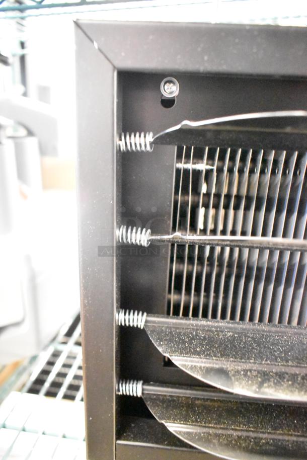 Boltic VF-7500 electric garage heater, ceiling-mounted, 240V, 1-phase, visible coils and fins, new scratch and dent condition.