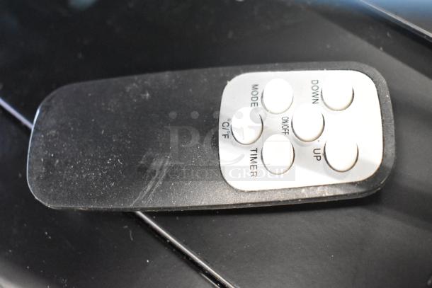 Remote control for Boltic VF-7500 heater, featuring buttons for mode, temperature, timer, power, and adjustment.