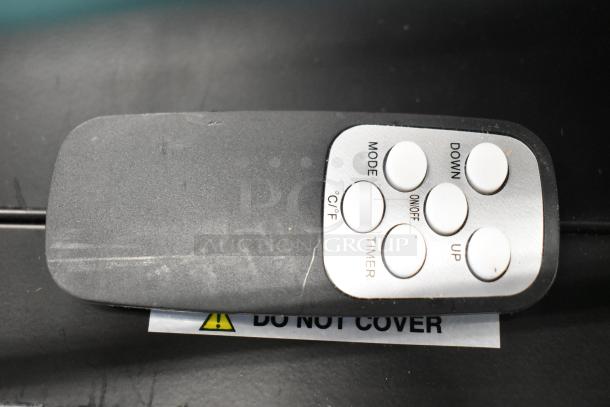 Remote control for Boltic VF-7500 electric heater with labeled buttons: Mode, Down, C/°F, ON/OFF, Timer, Up.