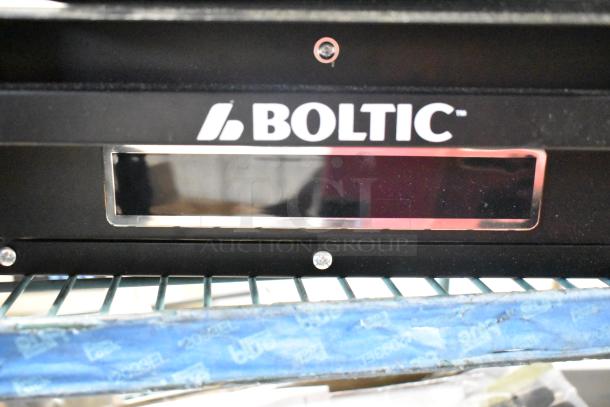 Brand-new Boltic VF-7500 electric heater, ceiling-mounted, 240 volts, 1 phase, black finish, visible Boltic logo.