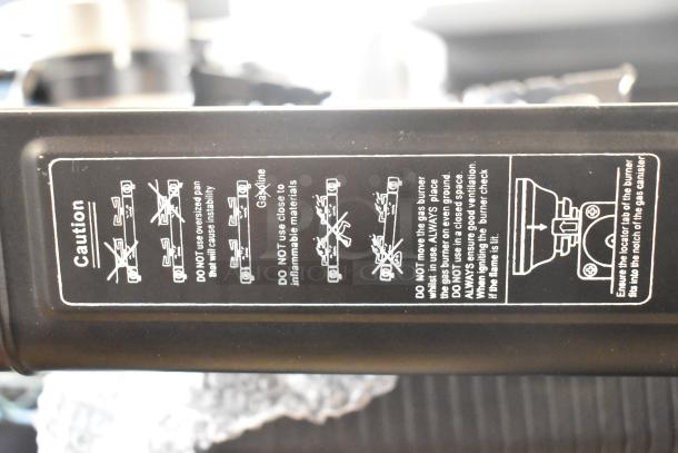 BRAND NEW Choice LR-KT300 2-Burner Butane Range, 30000 BTU, brass burners. Scratch and dent condition. Label shows usage cautions.