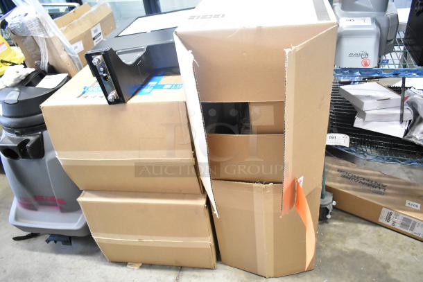 Four new Cooper Lighting fixtures in original packaging, some scratch and dent. Boxes stacked, showing partial fixture.