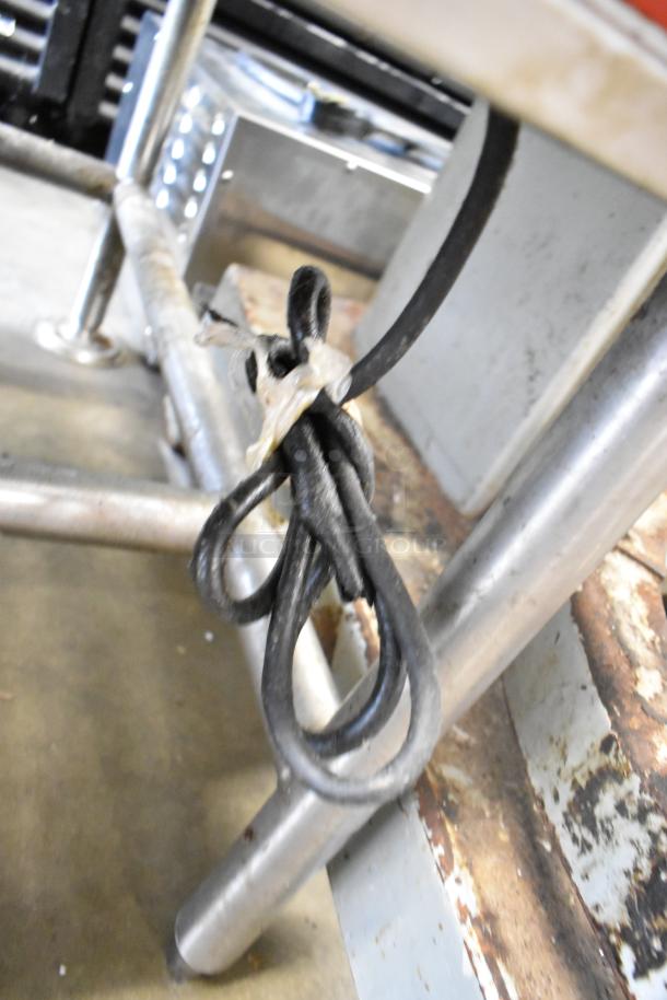 Vulcan Commercial Floor Style Braising Pan, metal frame visible, electrical cord tied with plastic band, appears used.
