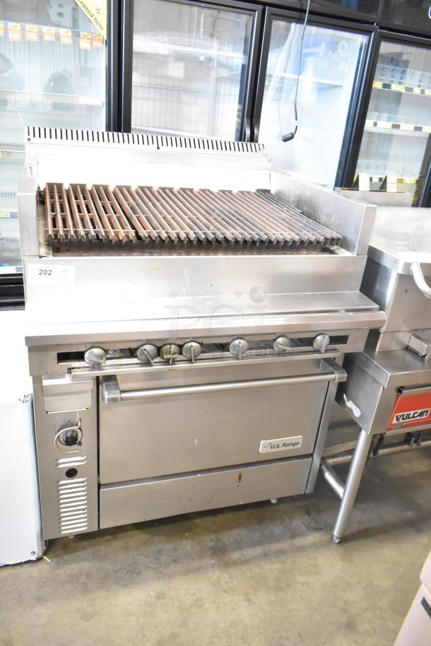 US Range commercial gas-powered charbroiler grill with oven. Stainless steel, used condition, visible brand label.