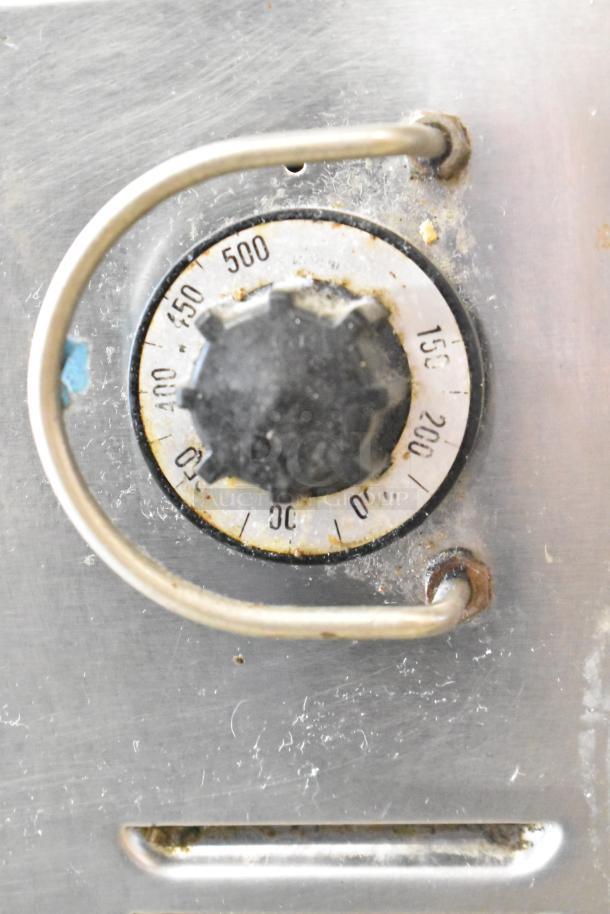 US Range Commercial Charbroiler Grill temperature dial, showing temperature settings from 150 to 500 degrees. Minor wear visible.