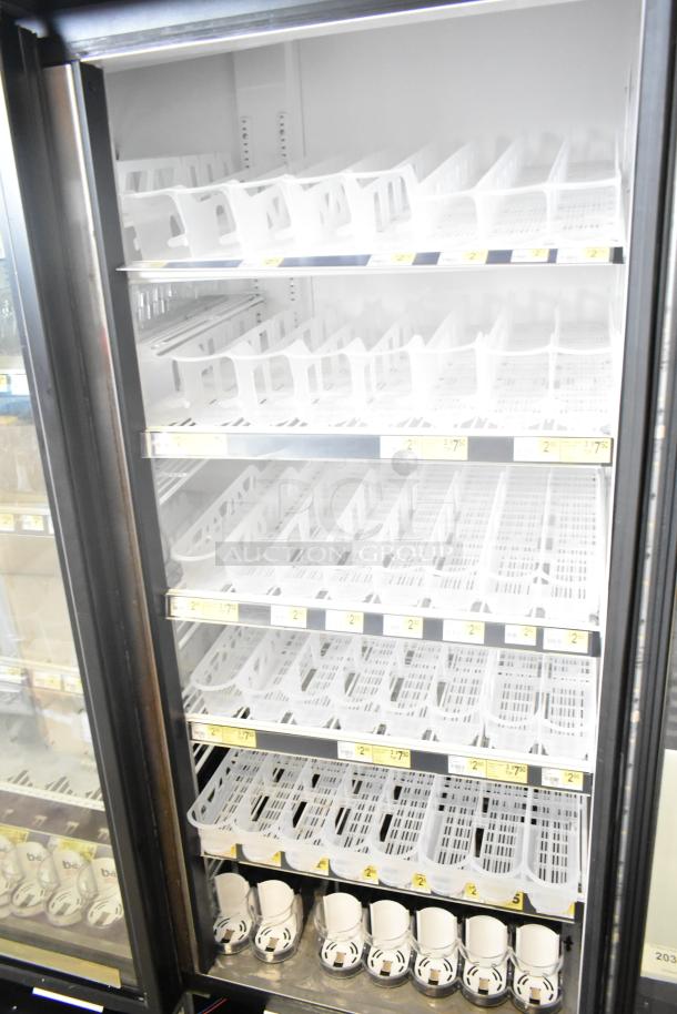 2017 True GDM-72-HC commercial 3-door cooler merchandiser, 115 volts, 1 phase, clean interior, adjustable shelves.