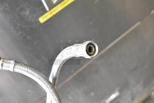 Close-up of a flexible metal hose end for the Cleveland 24CGA10.2 Gemini steam cabinet, showcasing connection details.