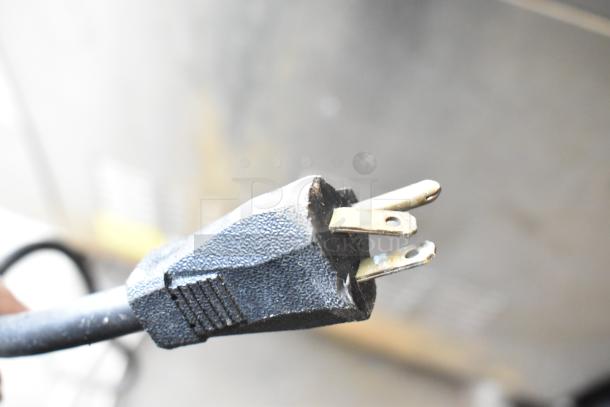 Close-up of a power plug from a 2016 Cleveland 24CGA10.2 Gemini Commercial Natural Gas Steam Cabinet.