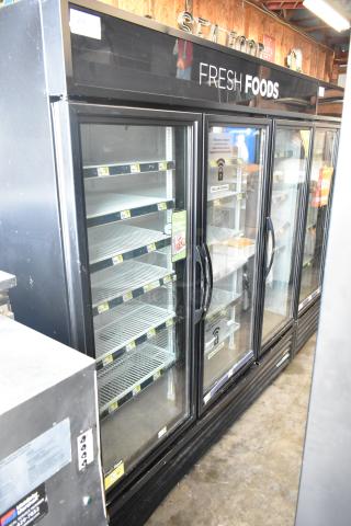 2017 True GDM-72-HC commercial 3-door cooler merchandiser in black. Features glass doors, shelves, and "Fresh Foods" signage.