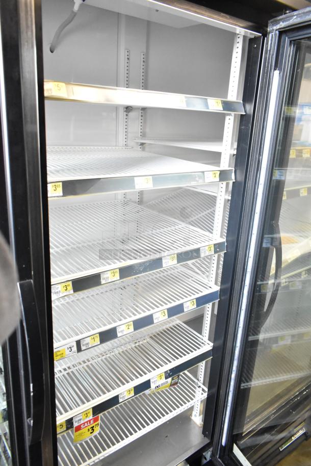 2017 True GDM-72-HC commercial 3-door cooler, 115 volts, 1 phase, clean interior, adjustable shelves, glass doors.