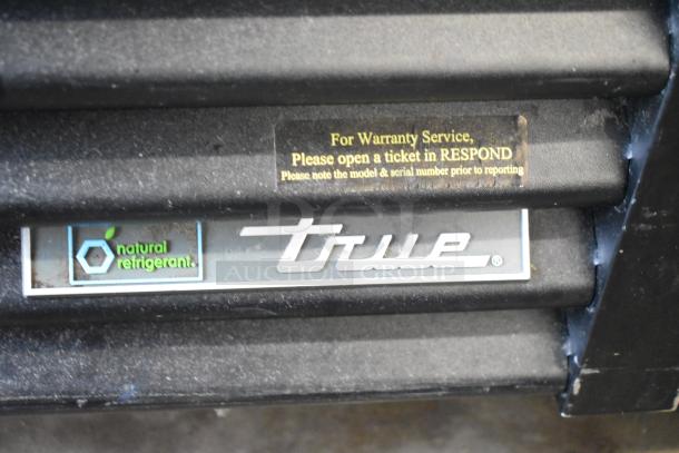 2017 True GDM-72-HC 3 Door Cooler Merchandiser. Features natural refrigerant. Warranty tag visible. 115V, 1 Phase.