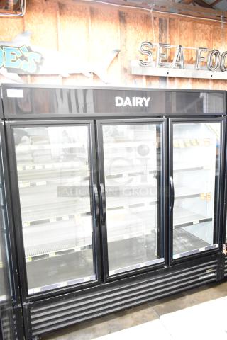 2017 True GDM-72-HC commercial 3-door reach-in cooler merchandiser, black frame, "Dairy" label, excellent condition.