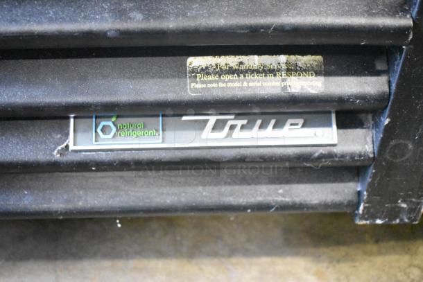 2017 True GDM-72-HC commercial cooler, 3-door, 115V, with "True" logo and natural refrigerant label visible.