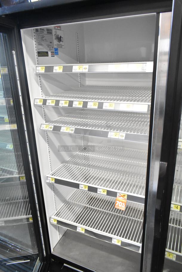 2017 True GDM-72-HC commercial cooler, 3 glass doors, reach-in design, clean condition, 115V, 1 phase, price labels visible.