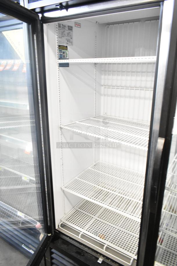 2019 True GDM-49F-HC commercial 2-door reach-in freezer merchandiser, 115/208-230V, 1 phase, clean interior, shelves intact.