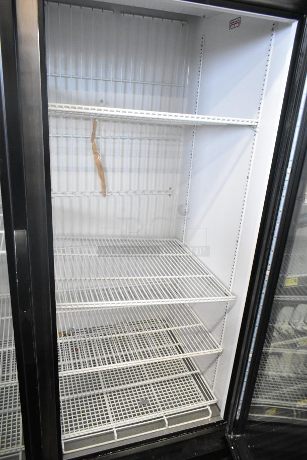 2019 True GDM-49F-HC commercial freezer, 2 glass doors, white wire shelves, well-maintained, 115/208-230V, 1 phase.
