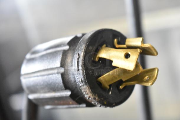 Close-up view of a power plug for the 2019 True GDM-49F-HC Commercial Freezer.