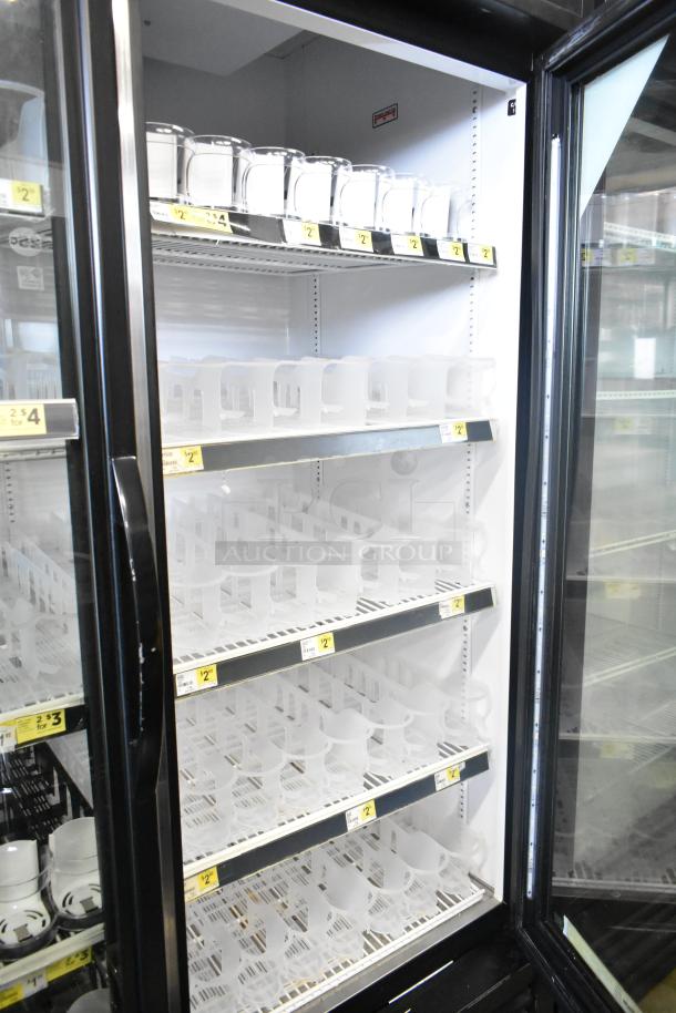 2017 True GDM-49-HC commercial cooler, two glass doors, adjustable shelves, 115V, 1 phase, clean condition, interior view.