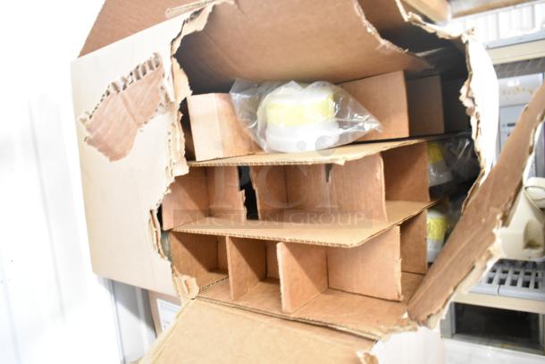 Box of 8 new Lithonia Lighting DSXF3 LED lights, model LED483788WU. Some box damage visible.