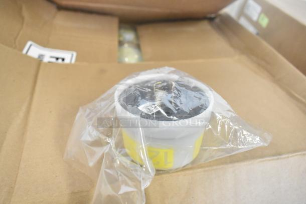 Box of Lithonia Lighting DSXF3 LED lights, new condition, partially visible through clear plastic wrap on a cardboard box.