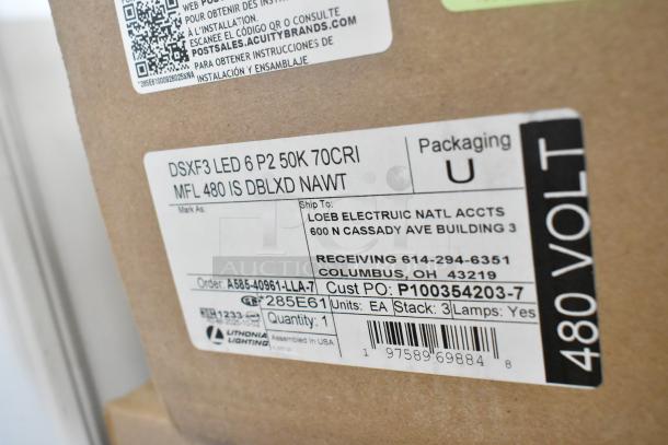 Box of Lithonia Lighting DSXF3 LED 6 P2 50K 70CRI lights, new scratch and dent, label showing specs and shipping info.