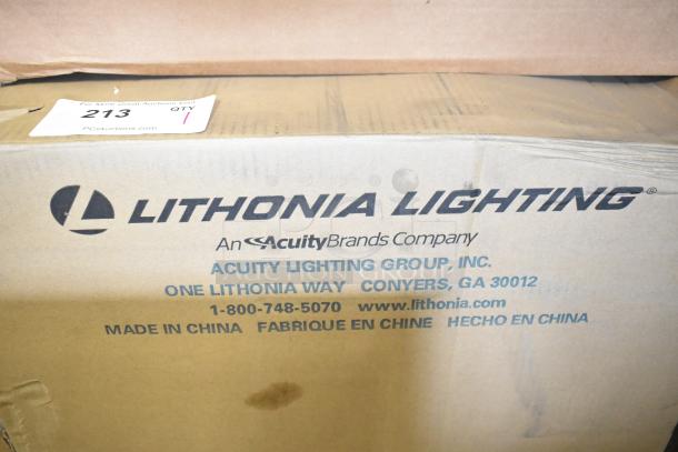 Box of Lithonia Lighting SCNY LED P1 40K PFL MVOLT DWHXD soffit canopy light, brand new with minor scratches, visible product labeling.