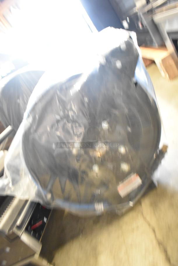 BRAND NEW SCRATCH AND DENT Regency hose reel, powder-coated steel, 100' x 3/8" hose, some visible packaging.