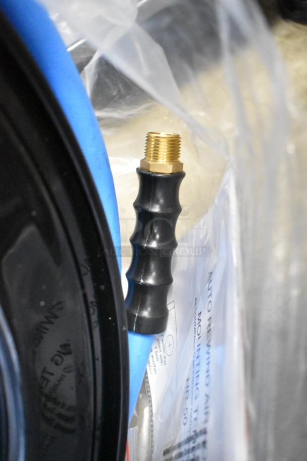 BRAND NEW Regency 600HRPC38100 hose reel with 100' x 3/8" hose. Open powder-coated steel, scratch and dent, blue and black details.