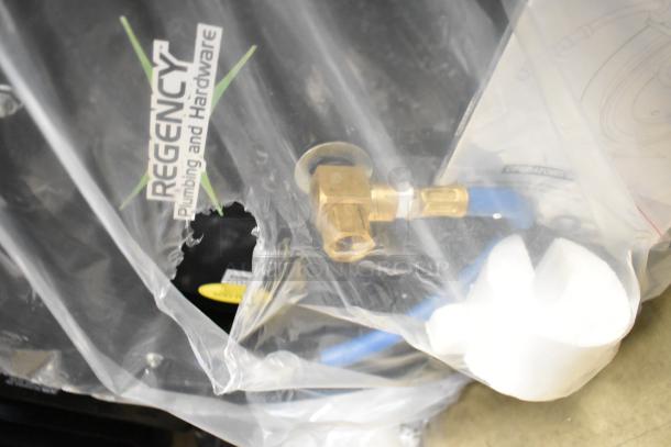 BRAND NEW Regency open powder-coated steel air/water hose reel in packaging, visible label. Includes hose, minor scratch and dent.