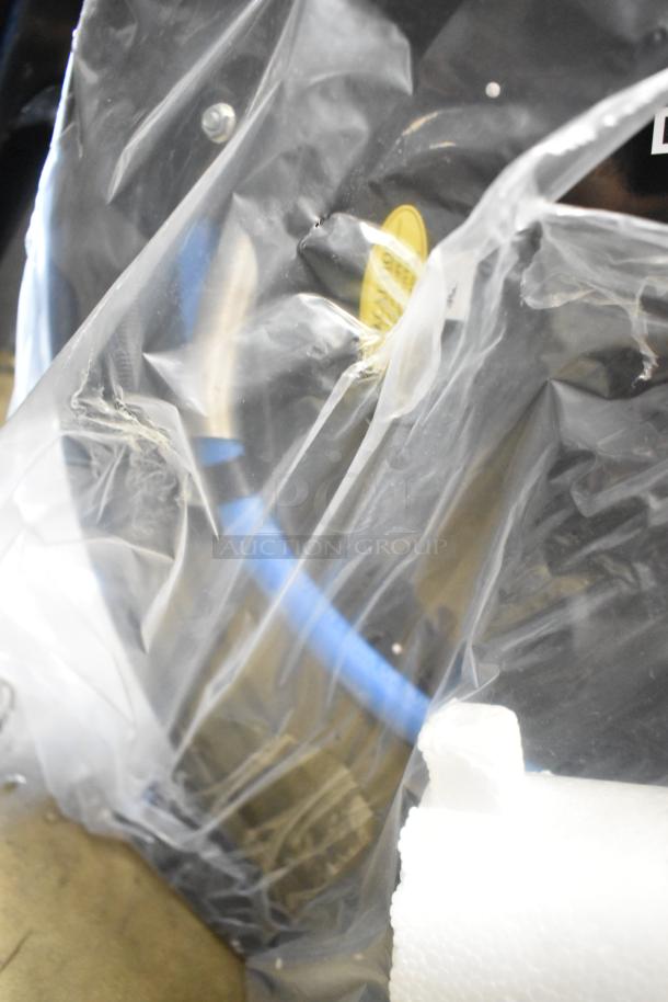 Brand new Regency open powder-coated steel air/water hose reel, visible blue hose, in protective packaging, scratch and dent condition.