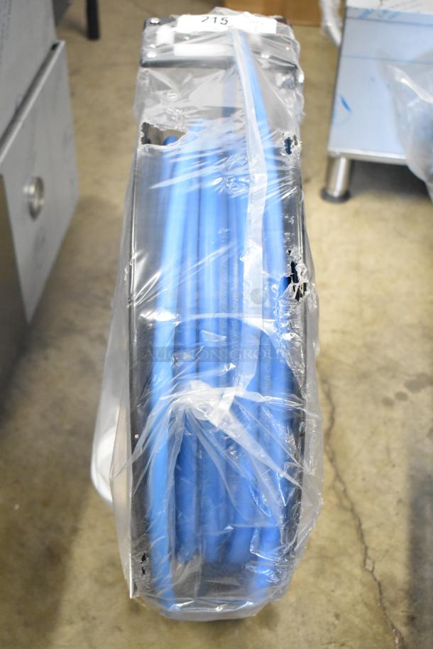 Brand new Regency powder-coated steel hose reel with hose, scratch and dent condition. Wrapped in plastic, item number visible.