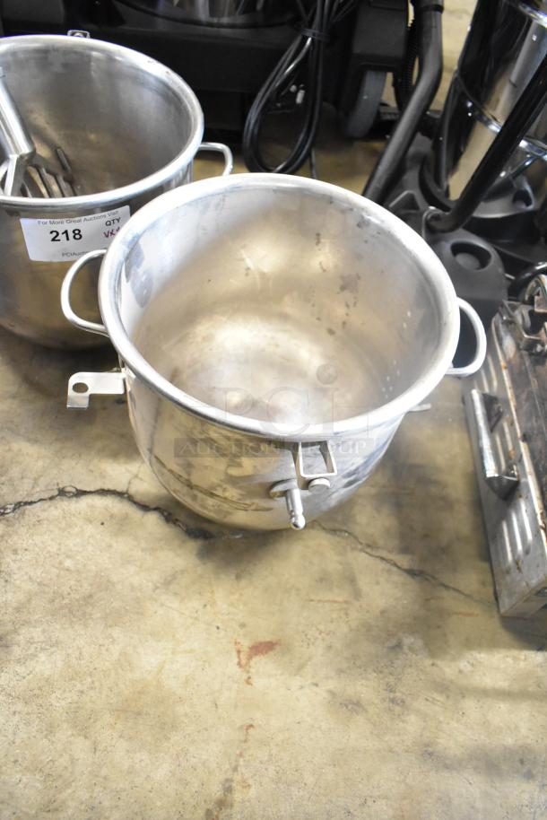 Set of 4 items: 2 commercial stainless steel mixing bowls, visible wear; 2 paddle attachments included, lot number 218.